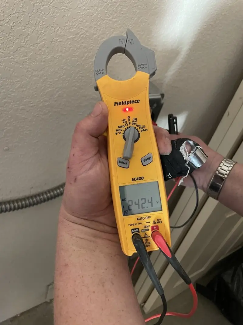 Voltage testing with clamp meter during Recessed Lighting Installation in Opelika